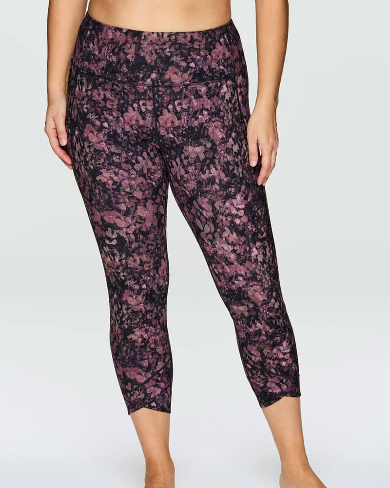 Front of a model wearing a size 1X Secret Garden Super Soft Tulip 7/8 Legging in Dark Pink by RBX Active. | dia_product_style_image_id:244854